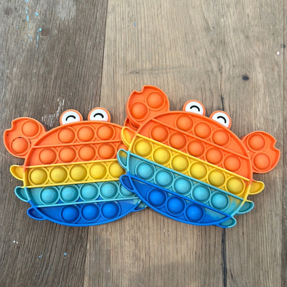 Two multi colored crab pop it’s